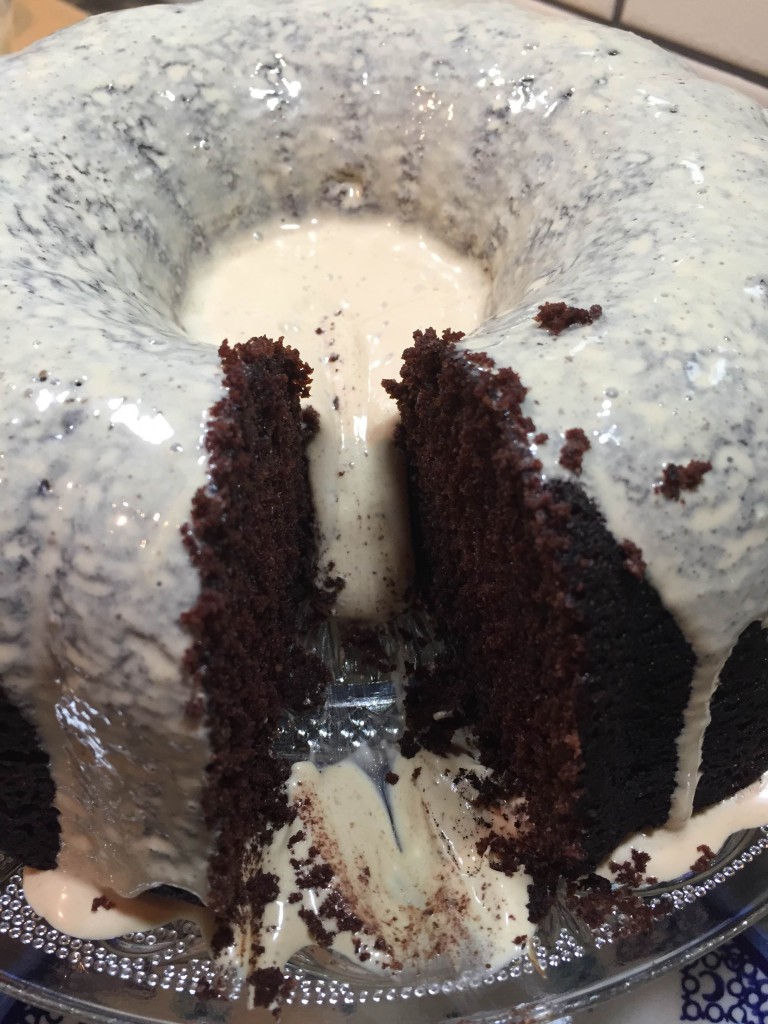 cutting into the moist chocolate cake
